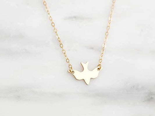 Goldene Halskette mit Taubenanhänger, filigranes Design, Damen-Schmuck, Geschenkidee.
