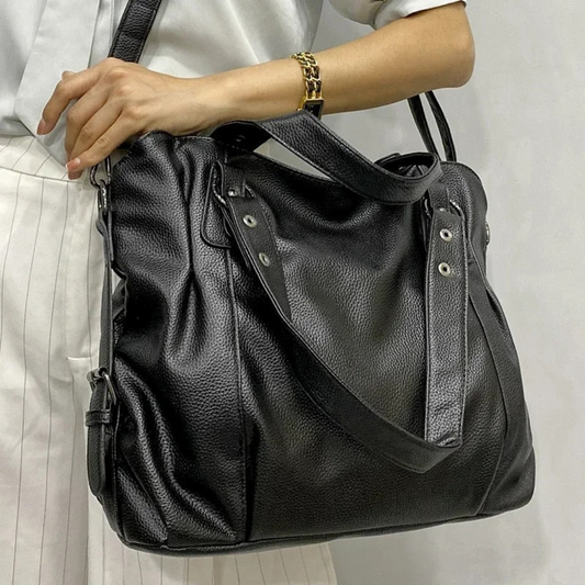 Damenhandtasche aus schwarzem Leder, elegant, mit Schulterriemen, modisch und geräumig.