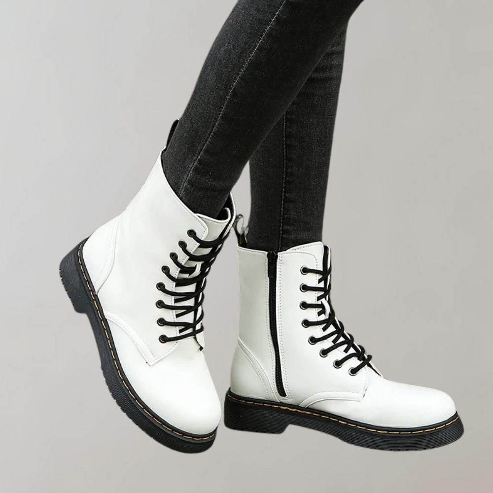 Weiße Damenstiefel aus Leder mit schwarzer Schnürung, modisch, robust, bequem.
