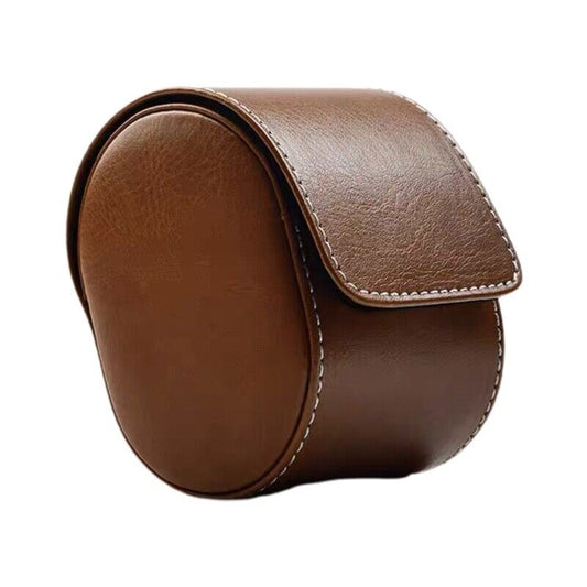 Braune Leder-Uhrenbox, rund, mit Klappdeckel, ideal für Reise und Aufbewahrung.