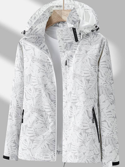 Weiße Damen-Regenjacke mit Blätterdruck, wasserdicht, Kapuze, Reißverschlusstaschen.
