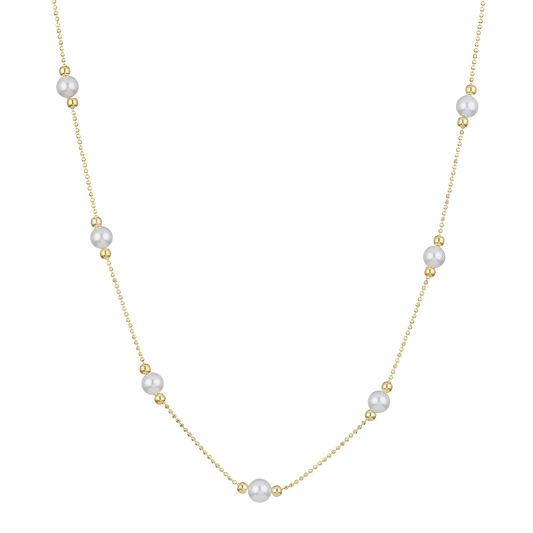 Goldene Halskette mit Perlen, elegantes Schmuckstück, Damenmode, luxuriöses Accessoire.