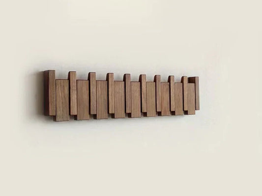 Moderner Holz-Wandhaken, klappbar, platzsparend, für Flur oder Garderobe, minimalistisches Design.