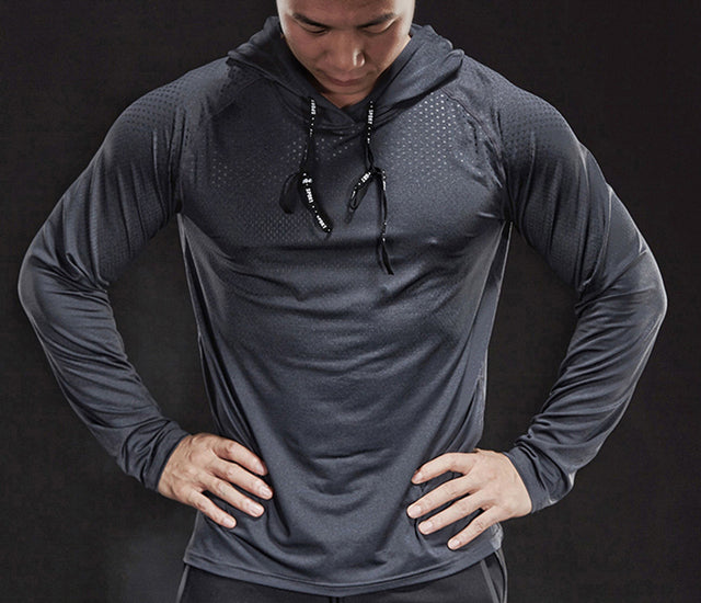 Graues Herren-Langarm-Sportshirt mit Kapuze, atmungsaktiv, ideal zum Laufen.