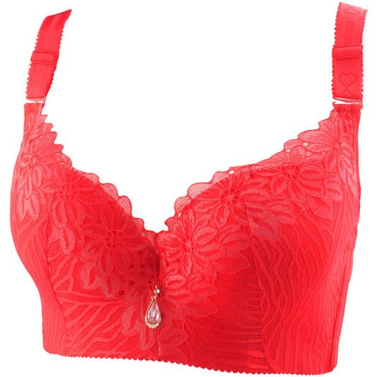 Roter Spitzen-BH mit Blumenmuster, verstellbaren Trägern und Schmuckanhänger.