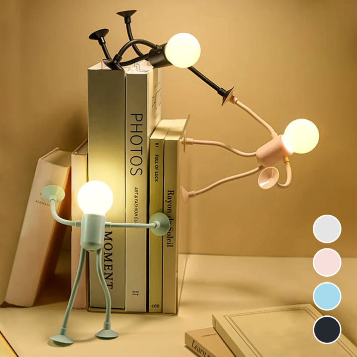 Drei Männchen-Lichter in Grün, Rosa und Schwarz klettern und stützen sich an einem Bücherstapel; rechts vier Farbmuster zur Auswahl. 5