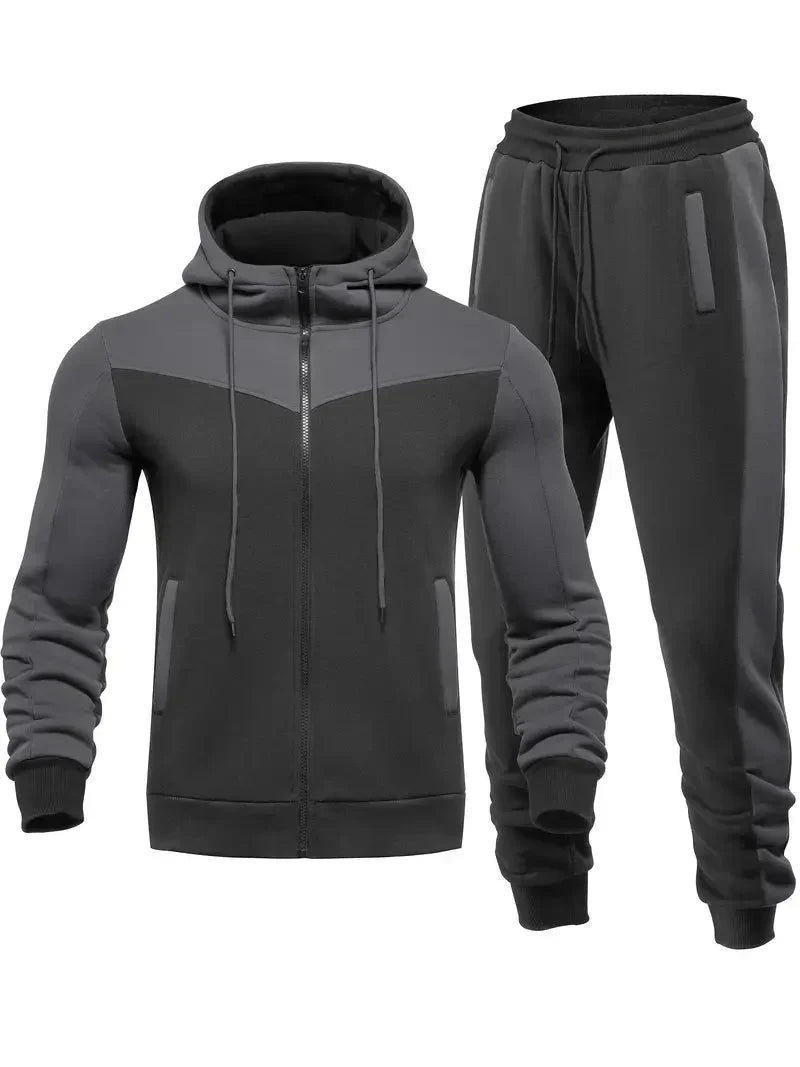 Dunkelgrauer Herren-Trainingsanzug mit Kapuze, Reißverschluss und Taschen, Sportbekleidung.