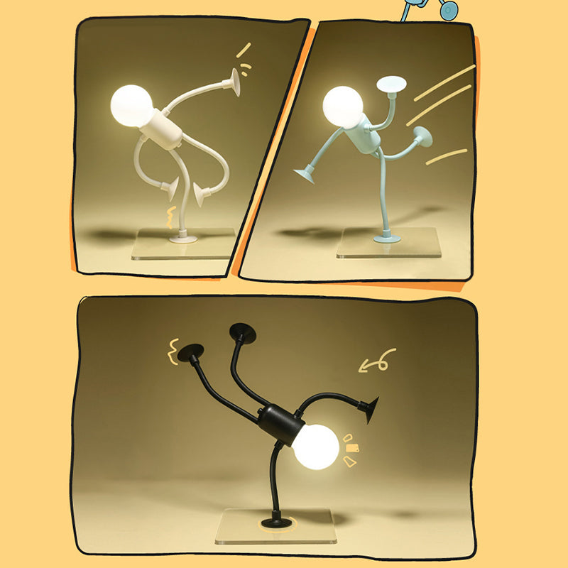 Drei leuchtende Männchen-Lampen in Weiß, Hellblau und Schwarz in Kung-Fu-, Tritt- und Handstand-Posen auf Acrylplatten, comicartig gestaltet. 1