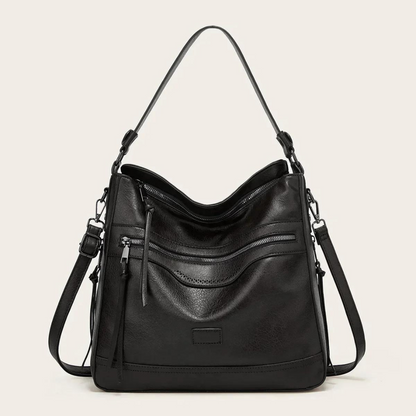 Schwarze Lederhandtasche mit Reißverschlusstaschen, verstellbarem Schulterriemen, elegant.