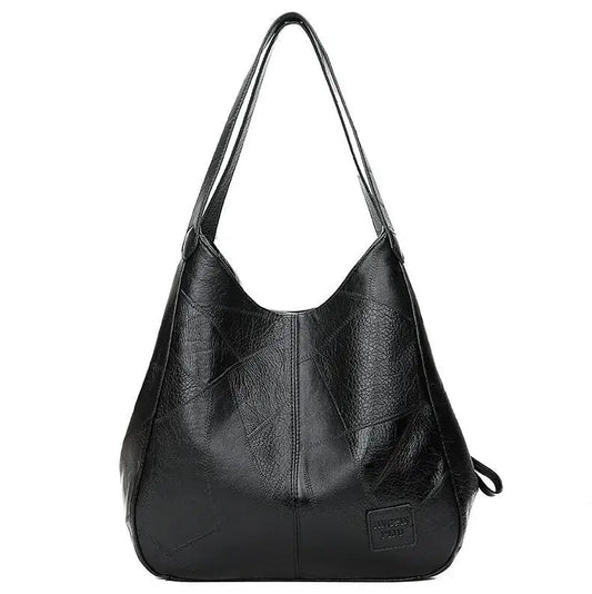 Schwarze Lederhandtasche für Damen, geräumig, modisch, mit langen Trägern, elegant.