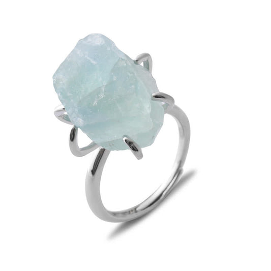 Silberring mit rohem Aquamarin-Edelstein, eleganter Schmuck, minimalistisches Design.