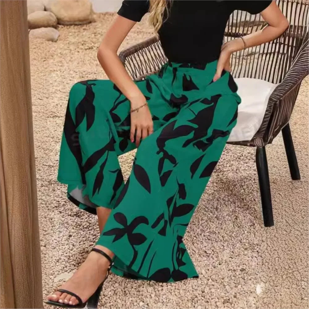 Damenhose mit weitem Bein, grün-schwarz, florales Muster, Frühling-Sommer-Mode 2024.