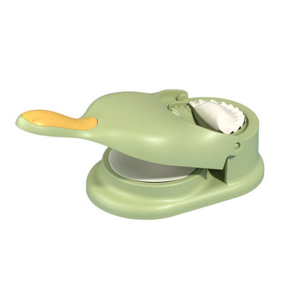 Grüner Teigformer aus Kunststoff, ergonomischer Griff, ideal für Ravioli und Teigtaschen.