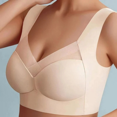 Nahtloser BH in Beige mit breiten Trägern und gekreuztem V-Ausschnitt, an einem Model von vorn getragen. 4