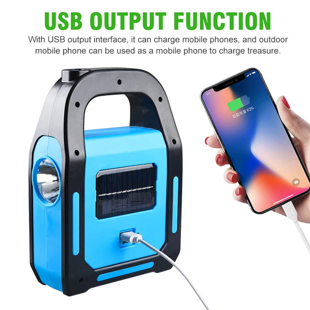Tragbare blaue Solarlampe mit USB-Ausgang, lädt Smartphones, ideal für Outdoor-Aktivitäten.