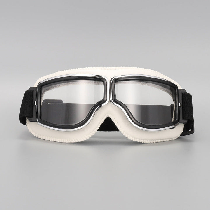 Fliegerbrille mit cremeweißer Polsterung, Chromrahmen und klaren Gläsern, Vorderansicht mit schwarzem Band. 13
