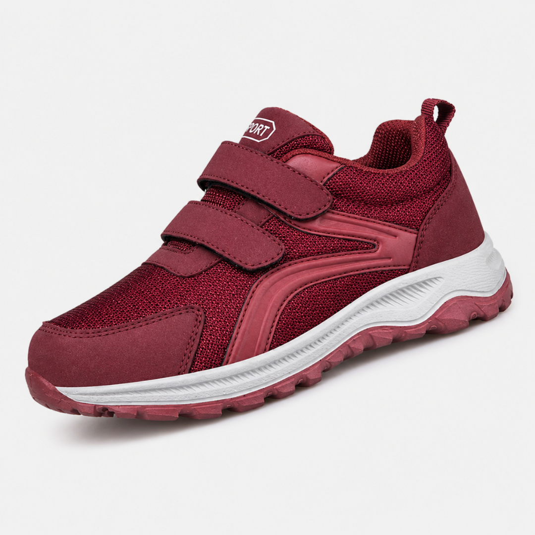 Einzelner roter Klettschuh mit zwei Riemen und weißer Sohle in Schrägansicht 7