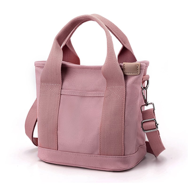 Rosa Canvas-Handtasche mit verstellbarem Schultergurt, modisch und praktisch für Damen.
