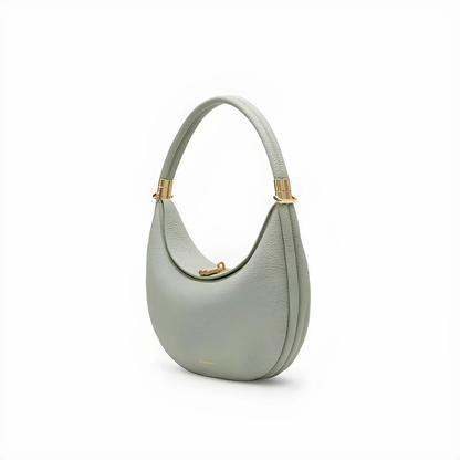 Elegante 4-in-1 Handtasche, hellgraues Leder, goldene Details, vielseitig und hochwertig.