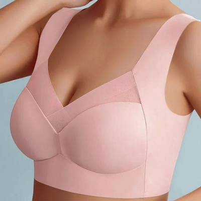 Nahtloser BH in Rosa mit breiten Trägern und gekreuztem V-Ausschnitt, an einem Model von vorn getragen. 2