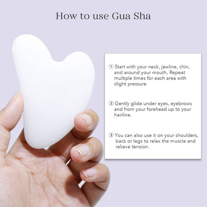 Weiße Gua Sha Gesichtsmassage Stein, herzförmig, für Hautpflege und Entspannung.