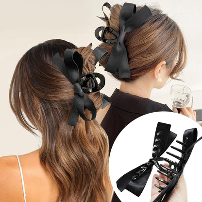 Schwarze Haarklammer mit Schleife, elegantes Haaraccessoire für Damen, modisch und stilvoll.