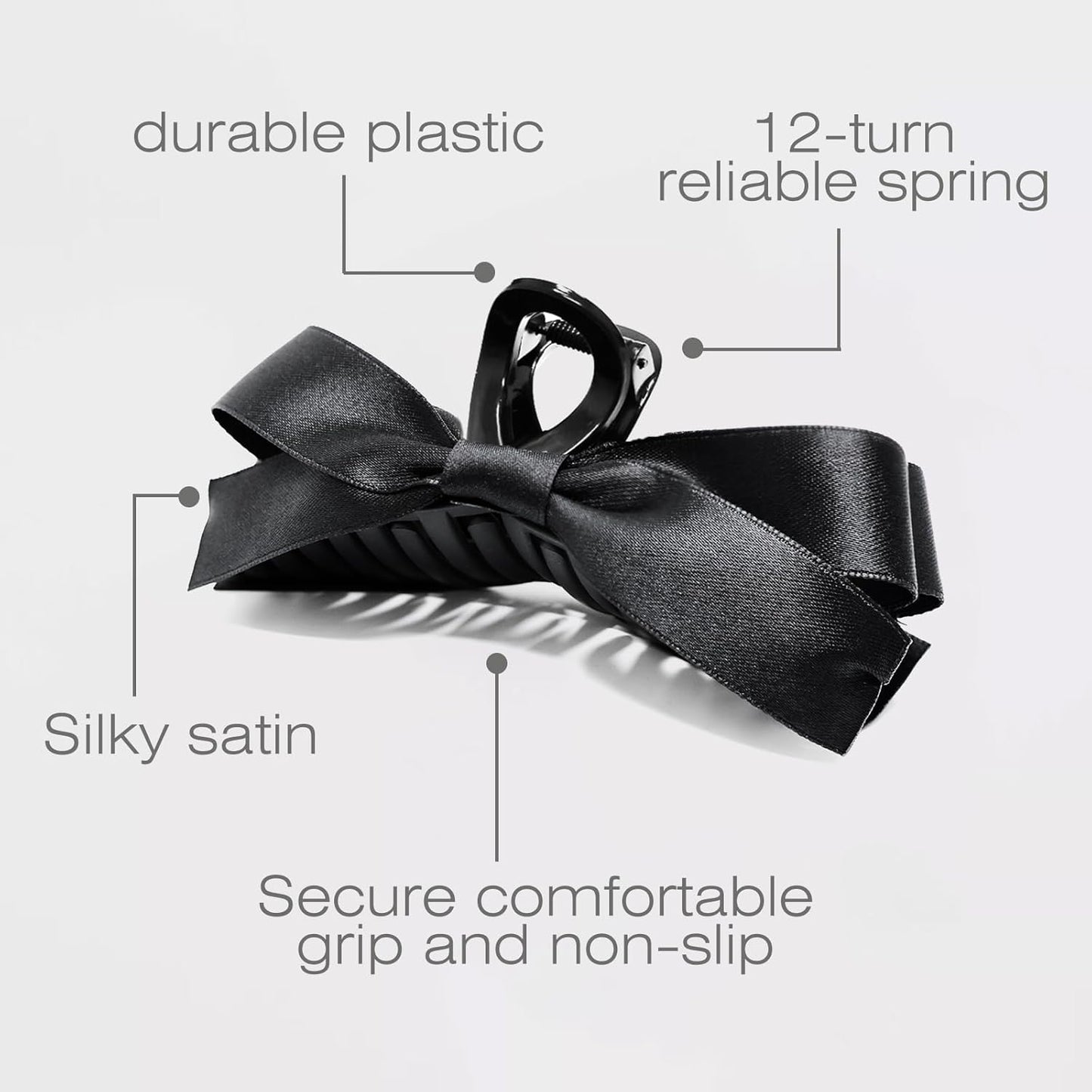 Schwarze Haarklammer mit Satin-Schleife, langlebigem Kunststoff, rutschfestem Griff.