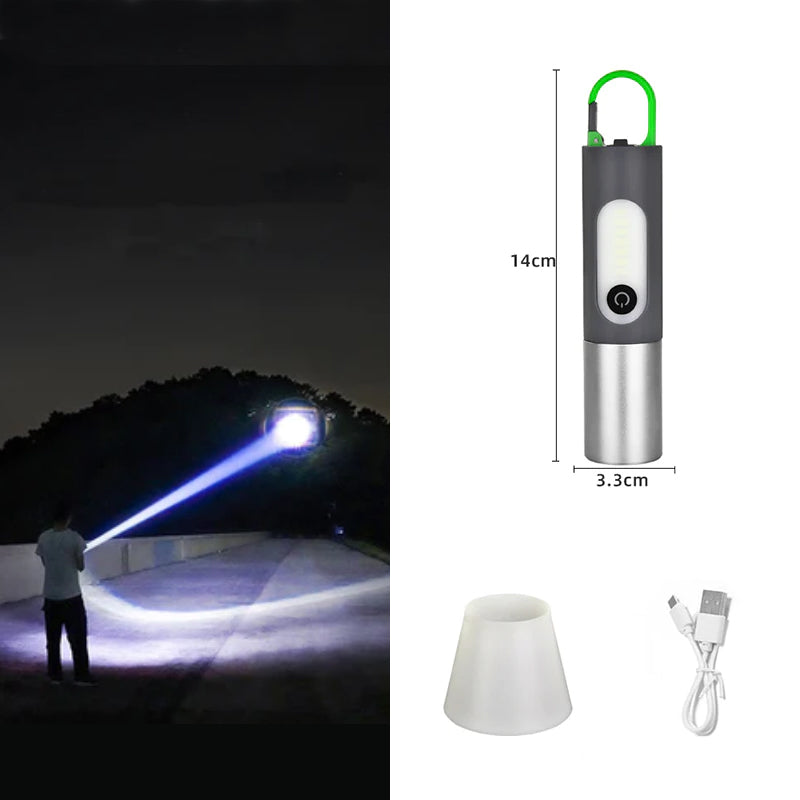 Tragbare LED-Taschenlampe, wiederaufladbar, schwarz-silber, mit USB-Kabel und Lampenschirm.