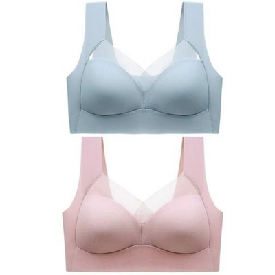 Zwei nahtlose Bralettes übereinander von vorn, oben in hellem Blau, unten in zartem Rosa, mit breiten Trägern und transparentem Einsatz im Ausschnitt. 23