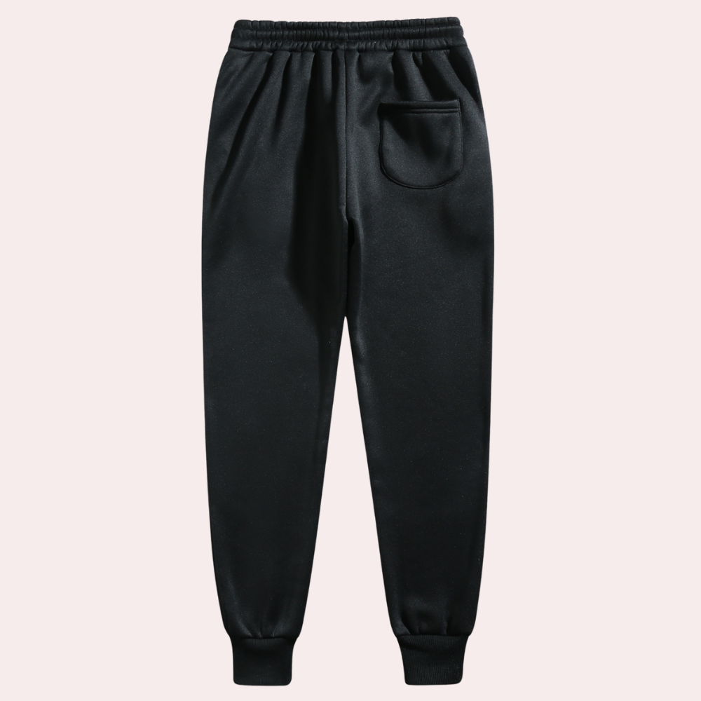 Schwarze Jogginghose, elastischer Bund, Seitentasche, Baumwolle, Herrenmode, bequem.