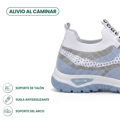 Fersenbereich des weißen Sneakers mit hellblauer Sohle, ergänzt durch Symbole zu Fersenhalt, rutschfester Sohle und Fußgewölbestütze 4