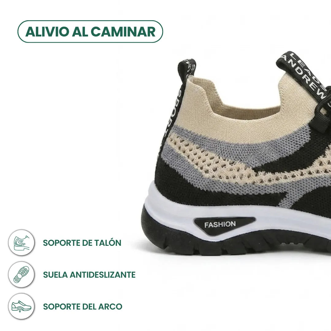 Detailansicht der Ferse des beige-schwarzen Mesh-Sneakers mit rutschfester Sohle und Infosymbolen zu Fersen- und Fußgewölbeunterstützung. 40