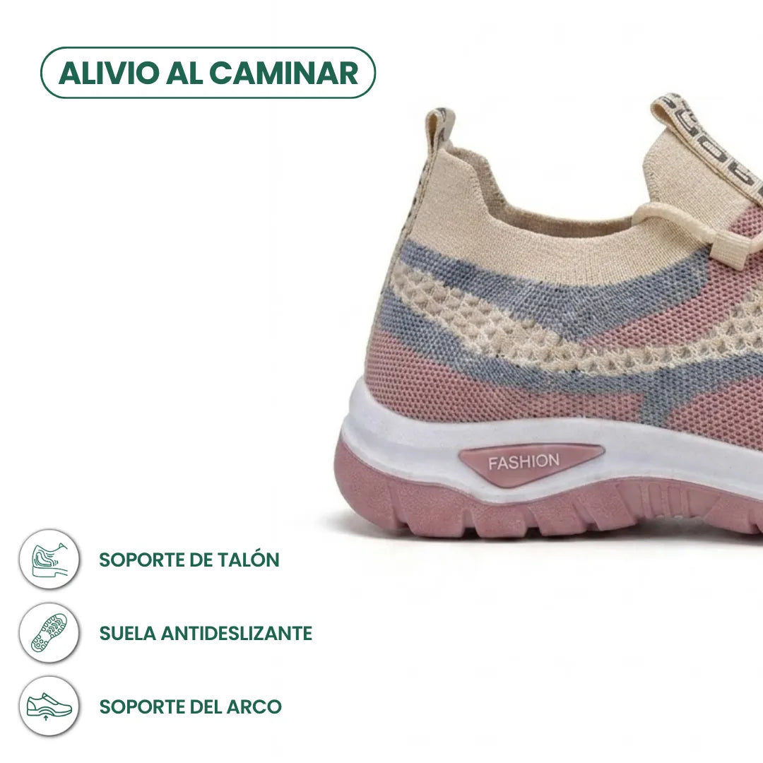 Detailansicht der Ferse des beigen Mesh-Sneakers mit rosa Akzenten, rutschfester Sohle und Infosymbolen zu Fersen- und Gewölbeunterstützung. 31