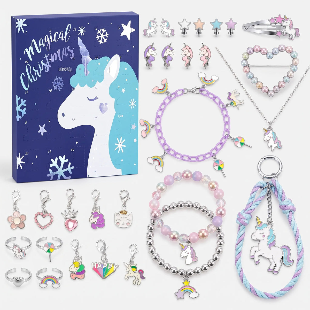 Blaue Variante mit Einhornmotiv und dem passenden Schmuck in Pastellfarben und Silber, flach ausgelegt 4