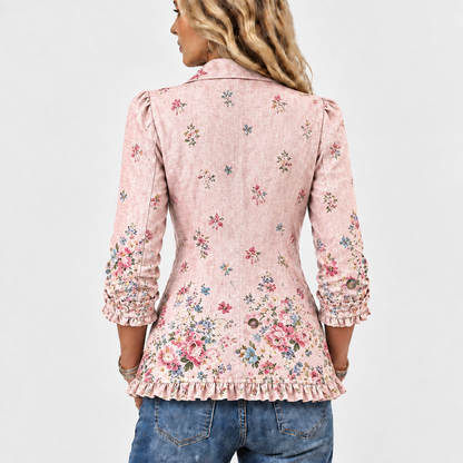 Rückansicht der rosa Jacke mit verstreutem Blumenmuster, das zum Saum hin dichter wird, Rüschensaum und Rüschen an den Ärmelenden. 5