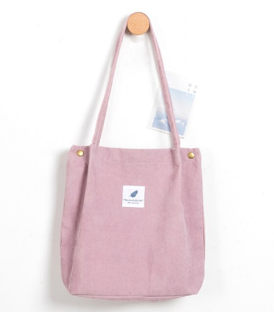 Rosa Stofftasche mit langen Henkeln, minimalistischem Design, ideal für den täglichen Gebrauch.