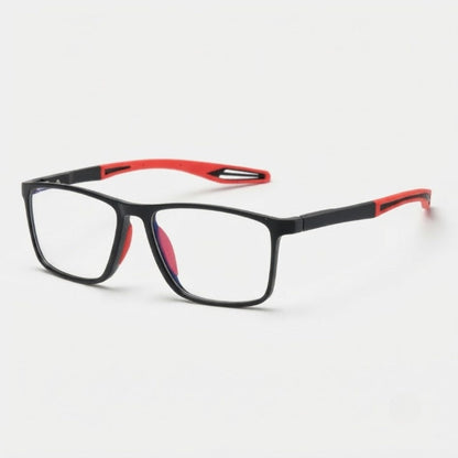 Eckige Lesebrille mit schwarzem Rahmen und roten, geschwungenen Bügelenden mit Aussparung, schräg von vorne auf hellem Hintergrund. 1