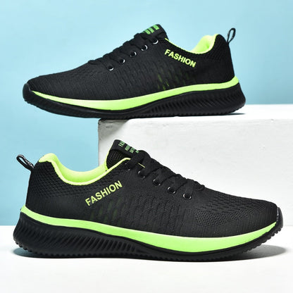 Schwarze Sportschuhe mit grünen Akzenten, atmungsaktiv, modisch, für Herren.