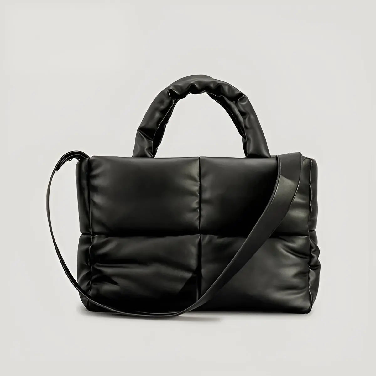 Schwarze gesteppte Handtasche aus Leder mit Schulterriemen, modisch, elegant, Damenaccessoire.