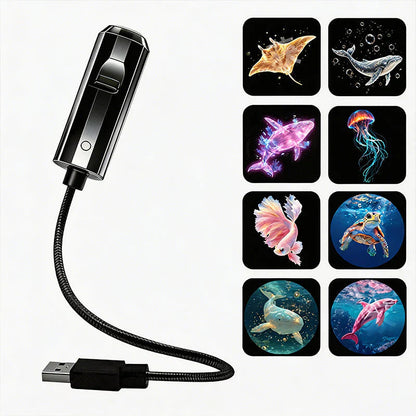Schwarzer Projektor mit USB-Kabel neben acht Meerestier-Motiven wie Rochen, Wal, Qualle, Kampffisch, Schildkröte und Delfin 8