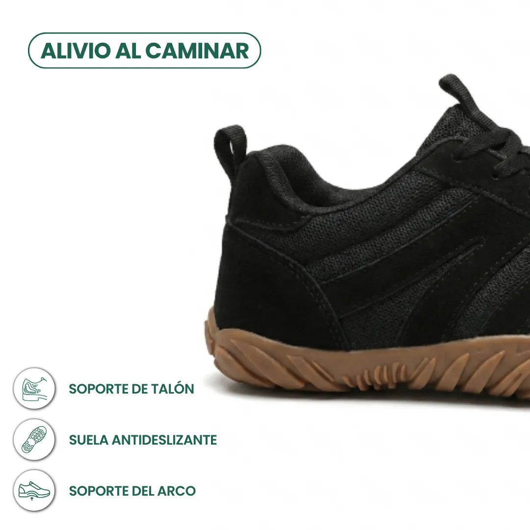 Schwarze Barfußschuhe in der Fersenansicht mit Mesh, Wildlederbesatz und heller Gummisohle, daneben Symbole zu Fersenhalt, rutschfester Sohle und Fußgewölbe. 22