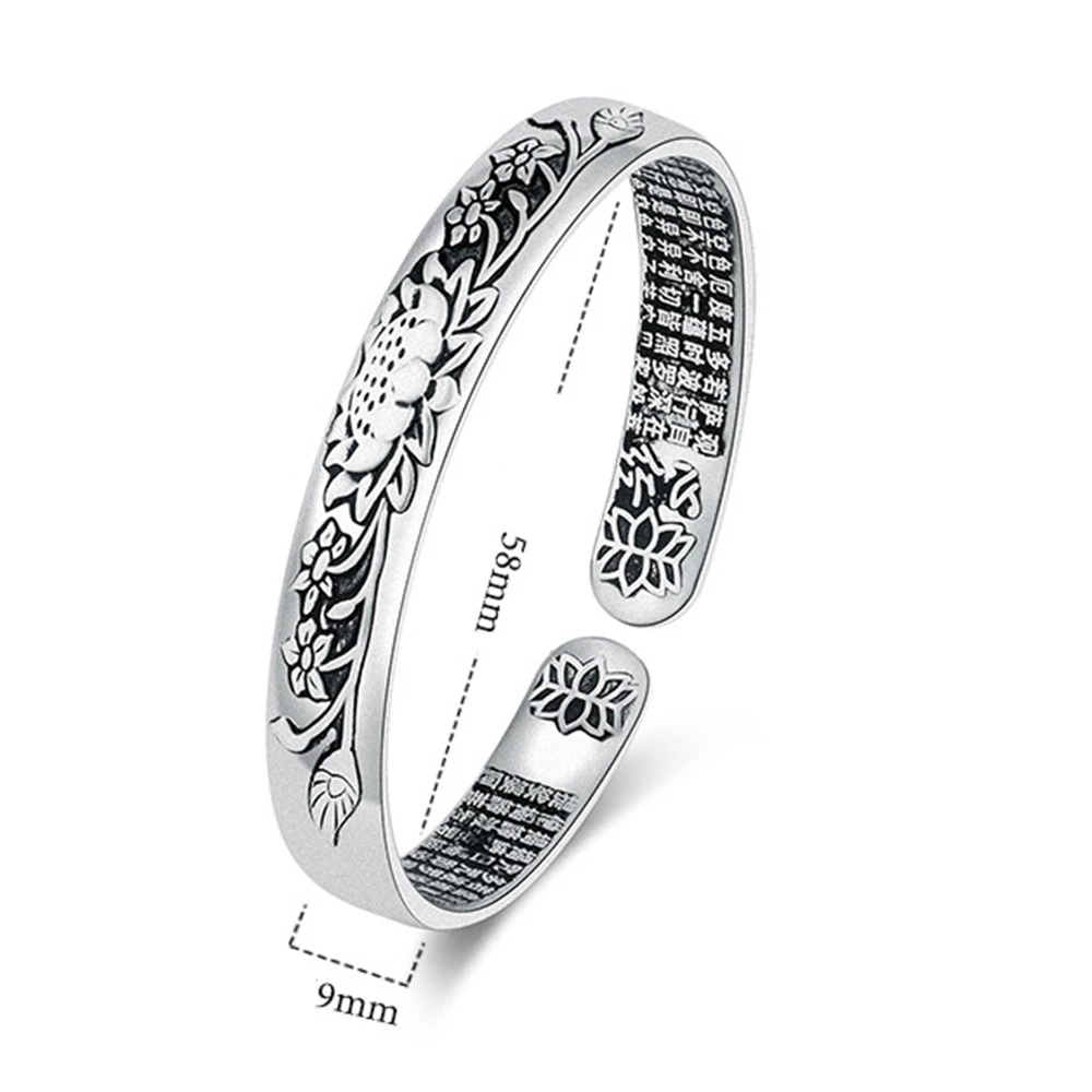 Silberarmreif mit Blumenmuster, 58mm Durchmesser, 9mm Breite, elegantes Schmuckdesign.