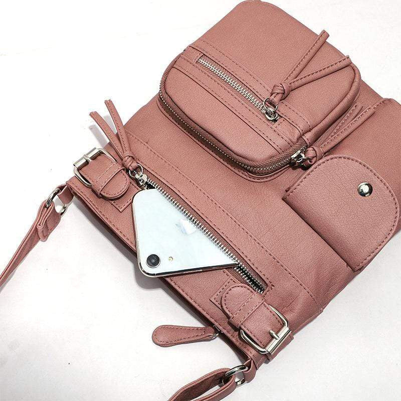 Rosa multifunktionale Anti-Diebstahl-Tasche aus Leder mit Reißverschlüssen und Fächern.
