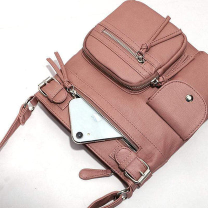 Rosa multifunktionale Anti-Diebstahl-Tasche aus Leder mit Reißverschlüssen und Fächern.