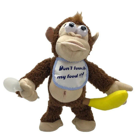 Brauner Plüschaffe mit Lätzchen, Löffel und Banane, Spielzeug, lustig, Kinder, Geschenk.