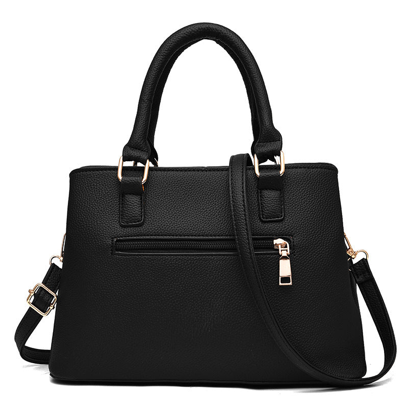 Schwarze Damenhandtasche aus Leder mit Reißverschluss, elegant, modisch, vielseitig einsetzbar.