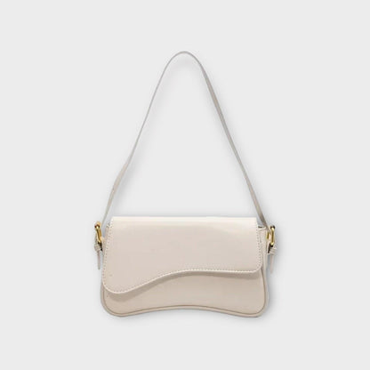 Weiße Lederhandtasche mit goldenen Details, elegantes Design, Damenmode Accessoire.