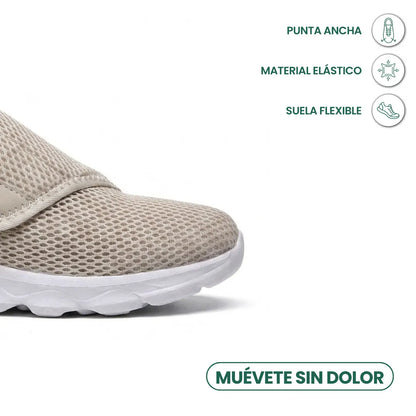 Nahaufnahme der Schuhspitze des beigen Netzschuhs mit breiter Zehenbox, elastischem Material und flexibler weißer Sohle, Merkmale mit Symbolen markiert. 32