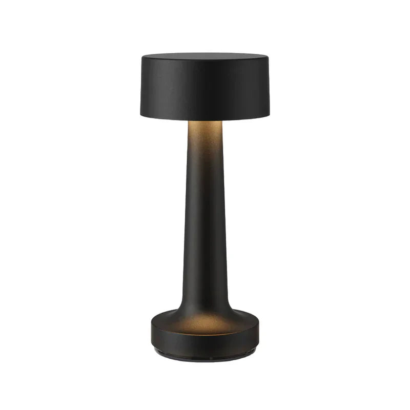 Schwarze zylindrische Tischlampe, kabellos, ideal für Restaurant oder Bar, modernes Design.