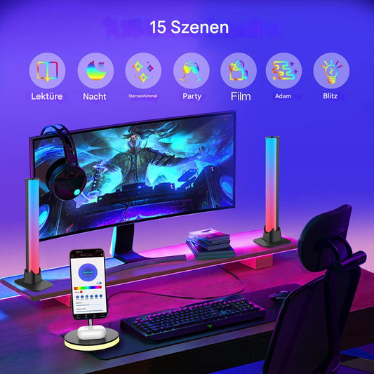 Gaming-Setup mit LED-Lichtleisten, RGB-Beleuchtung, Monitor, Tastatur, Kopfhörer, Smartphone.